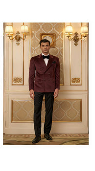 Man wearing a burgundy velvet double-breasted blazer with black lapels